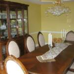 This cherry dining room set is finished with our dark walnut stain.  The dining room table is hand carved and features seating for 10 with a removable leaf.  The breakfront features carved glass doors, glass shelves, full extension drawers, along with hand carved moldings and fluted columns. 