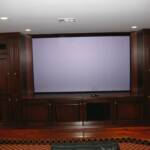 This media room unit is finished with our dark walnut stain.  It features solid cherry doors, built in speakers, and fluted column pullouts for DVD and CD storage.